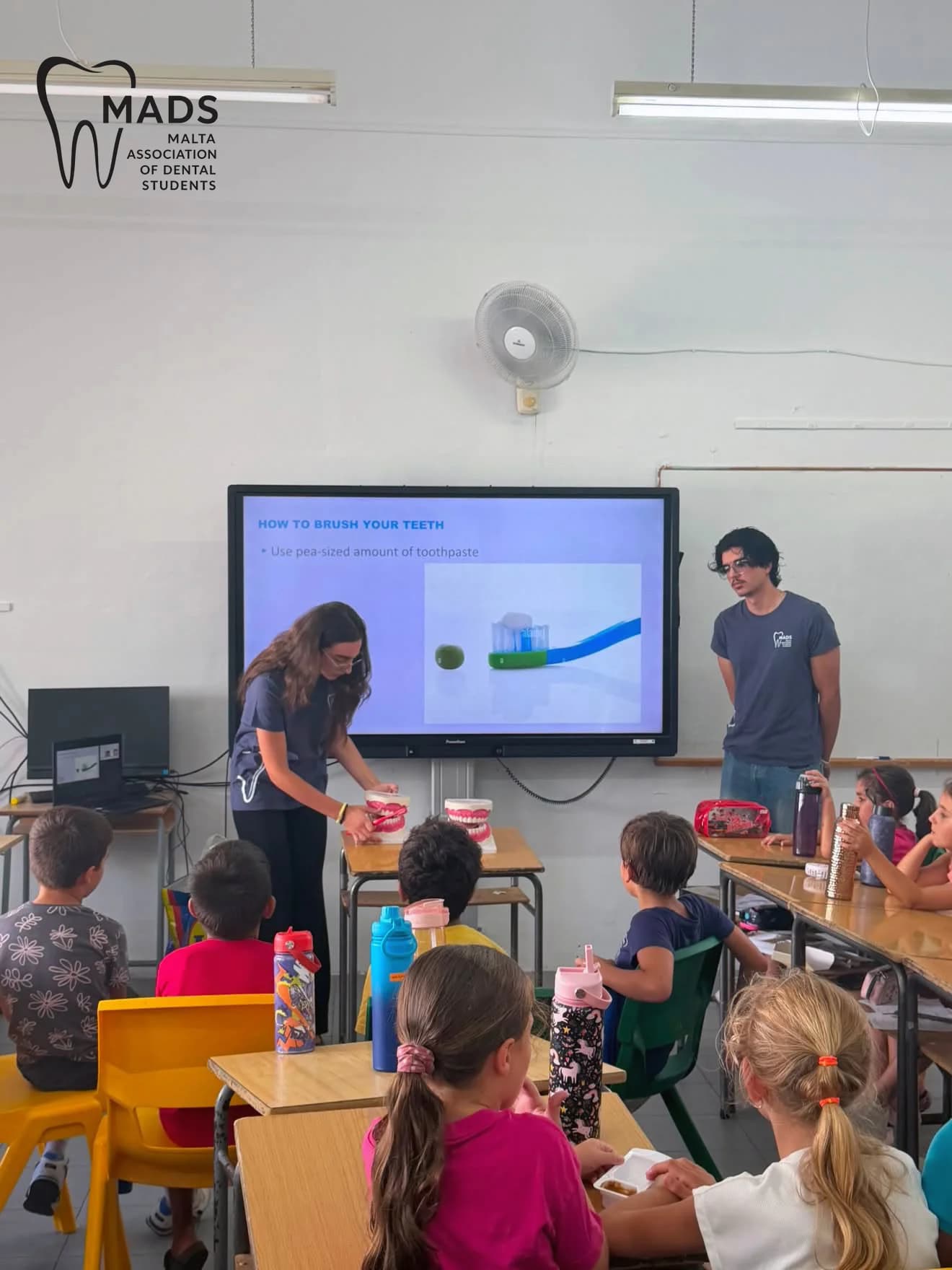 MADS volunteers delivering an oral-health presentation in Mosta